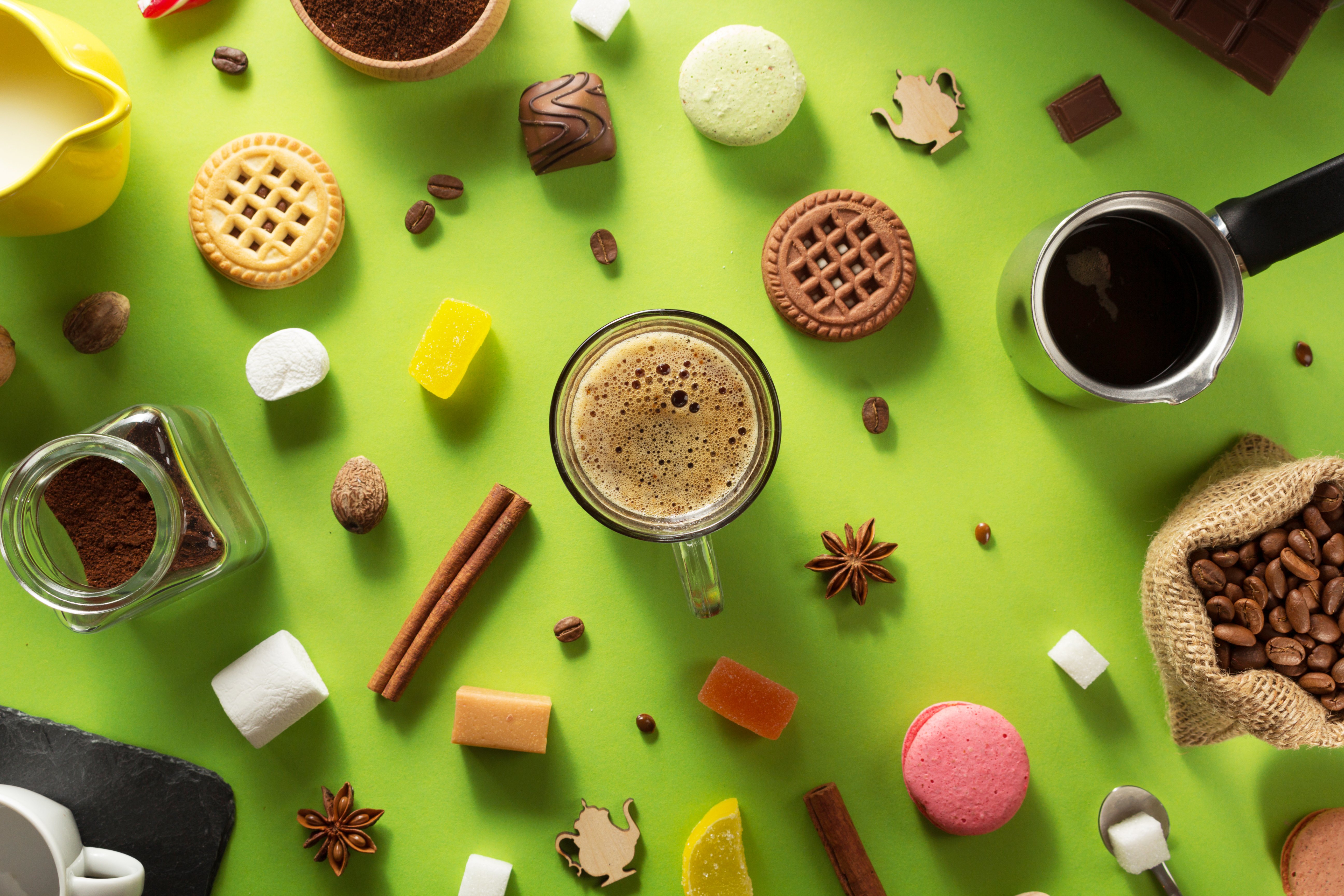 cup-of-coffee-and-ingredients-at-green-background-2023-11-27-05-00-07-utc