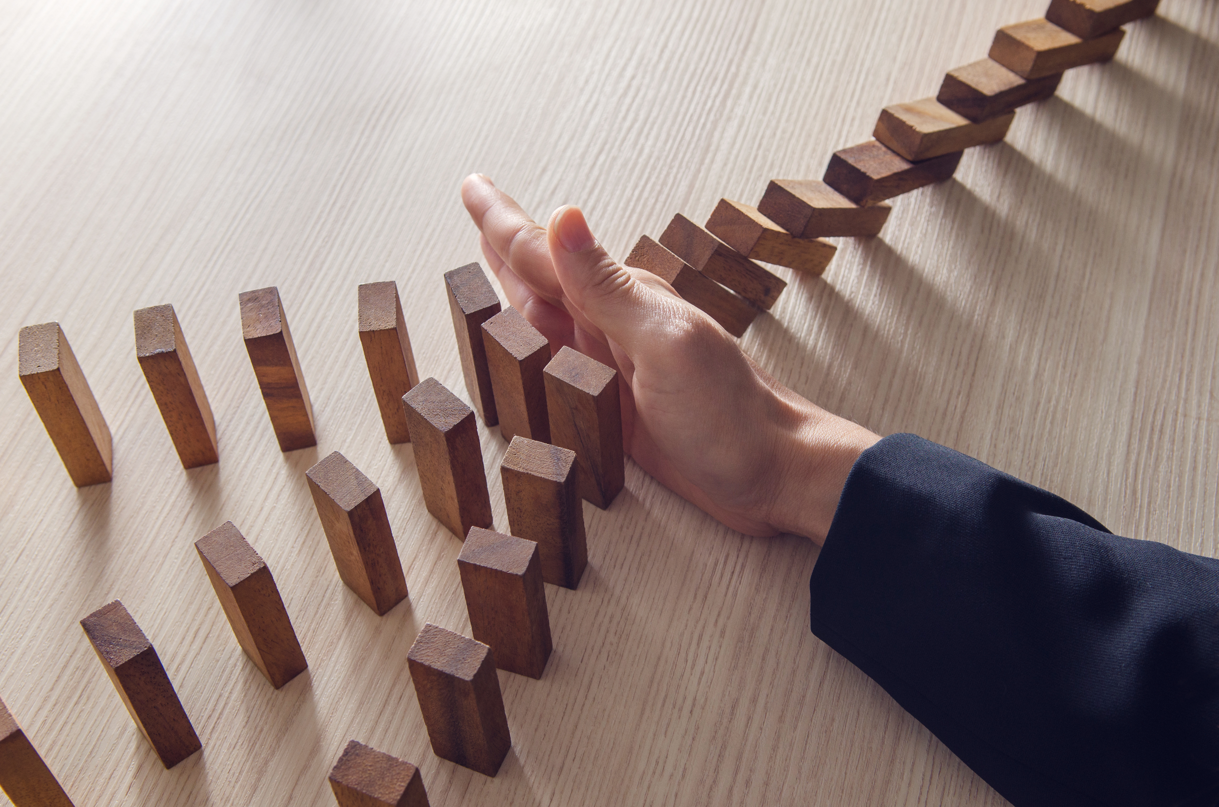 Handing stopping dominoes